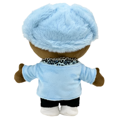 Plush toy with a blue outfit and hat on a white background
