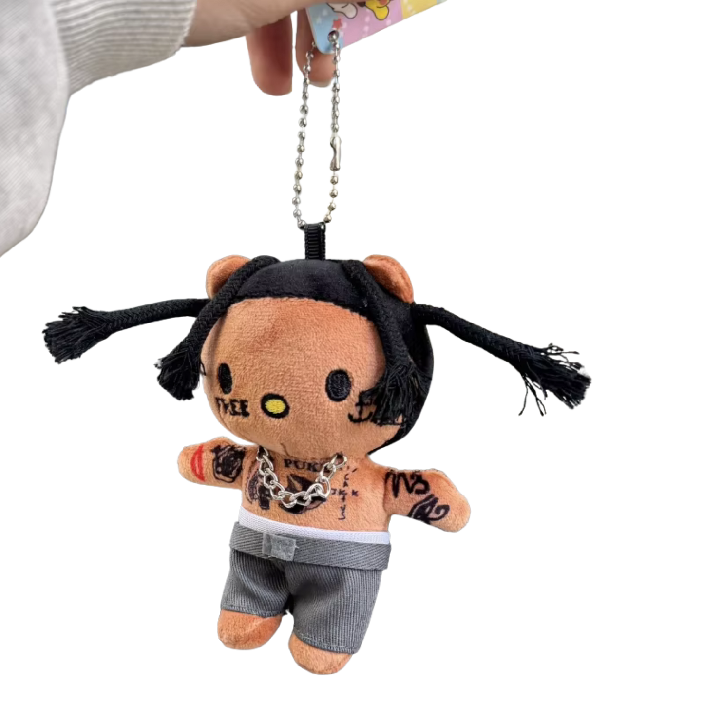 Plush keychain with a stylized design on a white background