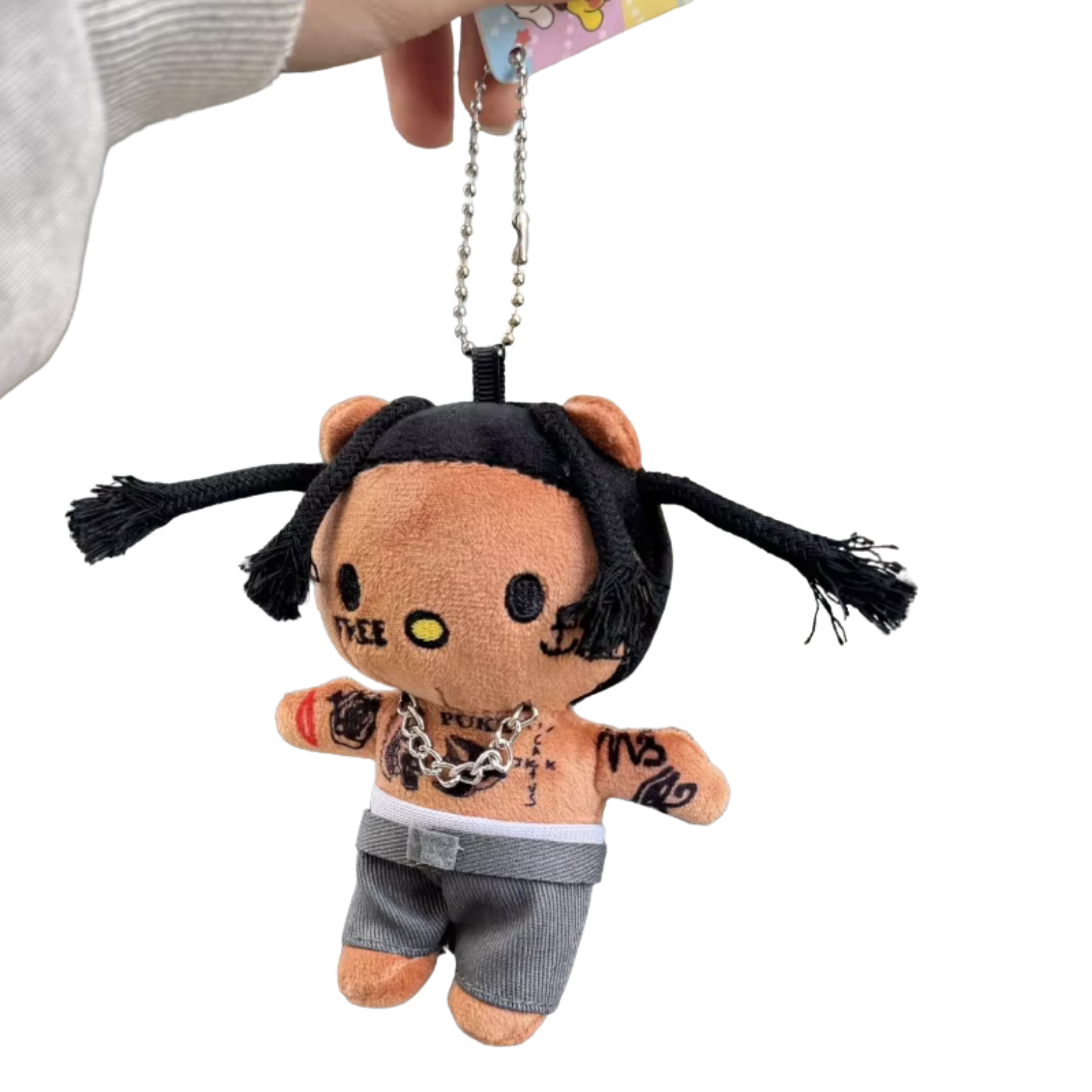 Plush keychain with a stylized design on a white background