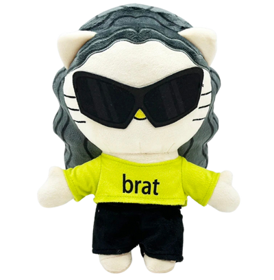 Plush toy resembling a cat with sunglasses and a 'brat' shirt on a white background